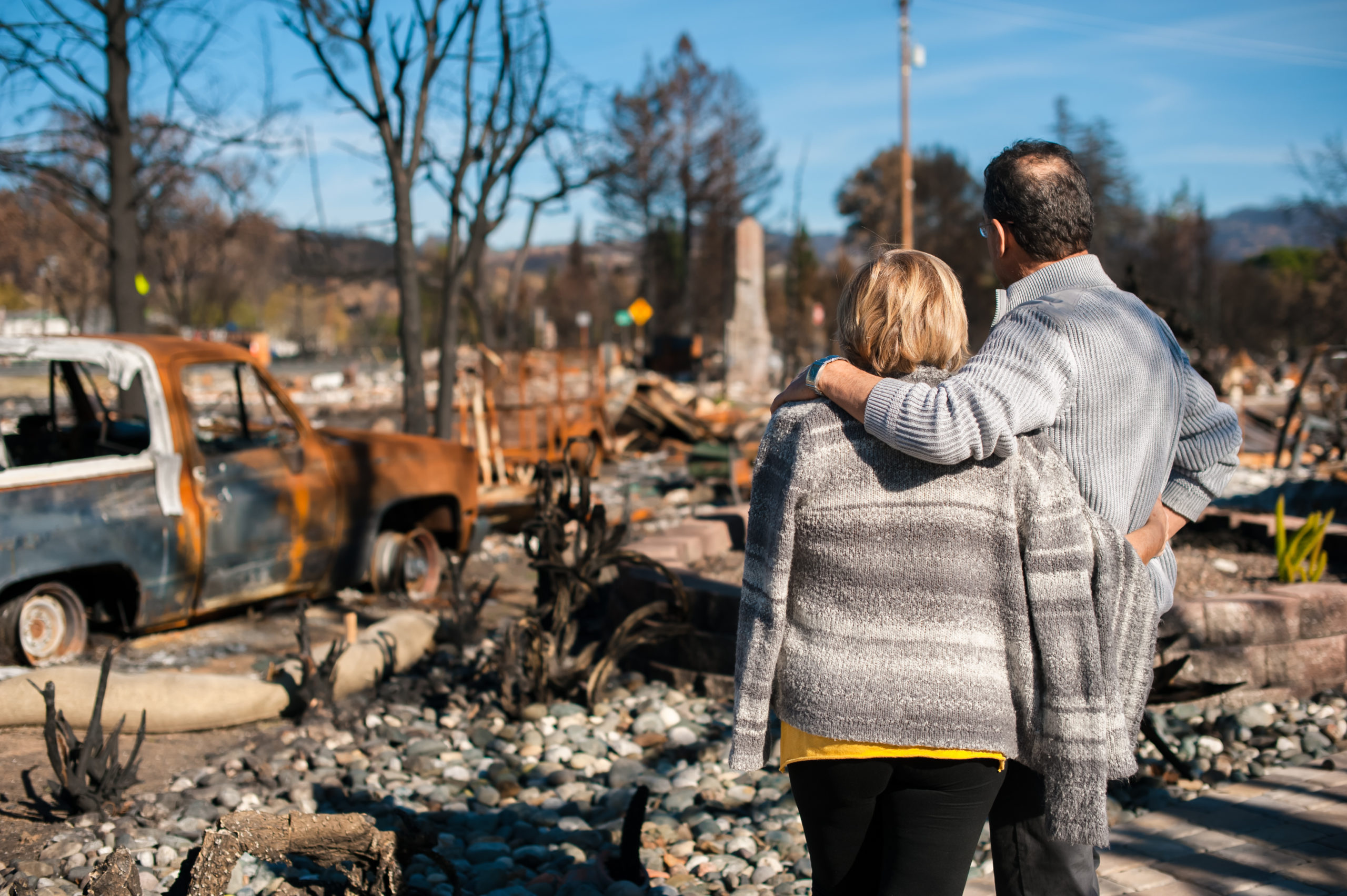 Man,And,His,Wife,Owners,,Checking,Burned,And,Ruined,Of Flood Insurance